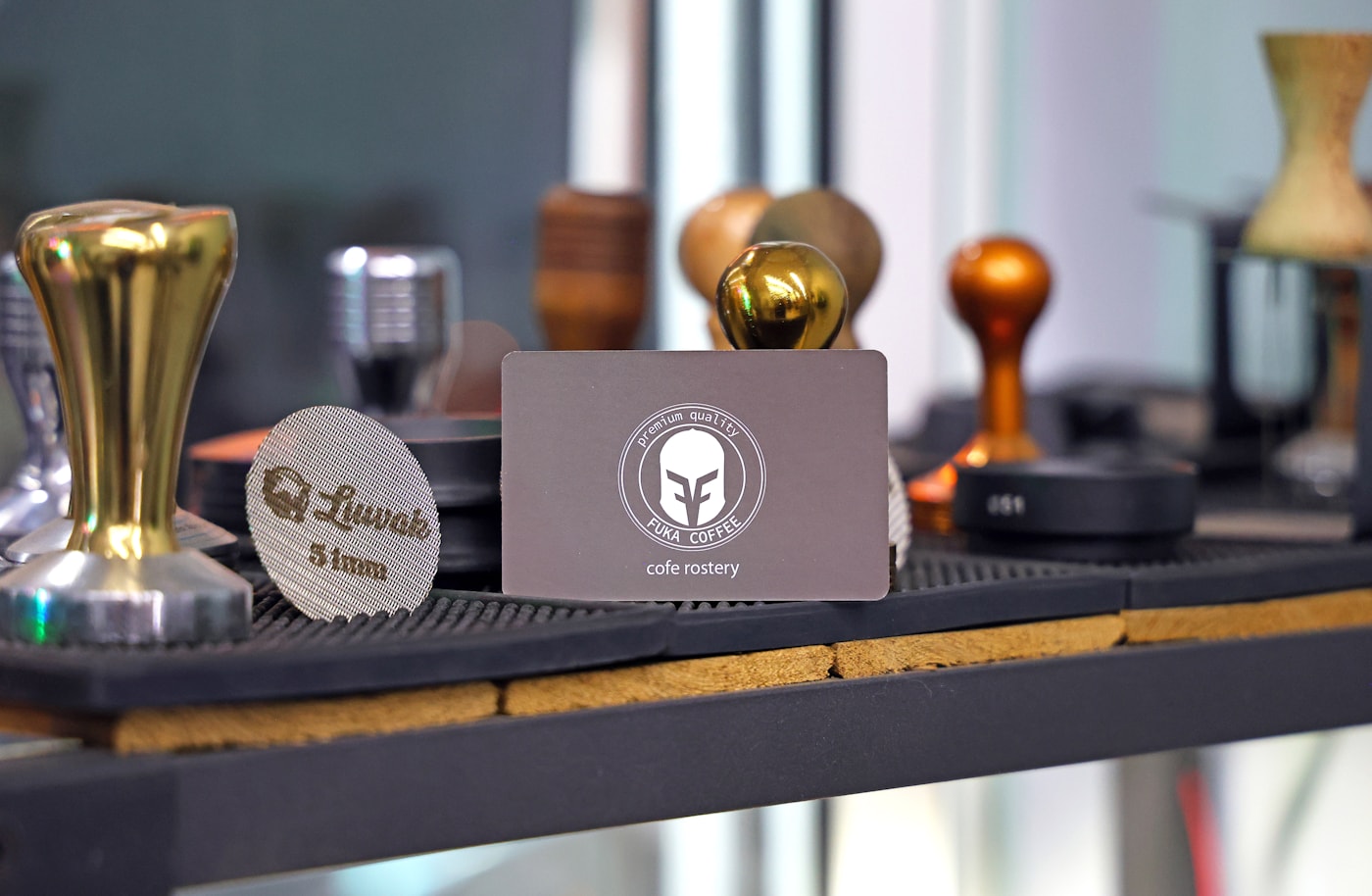 Precision espresso tools arranged beside a home coffee setup